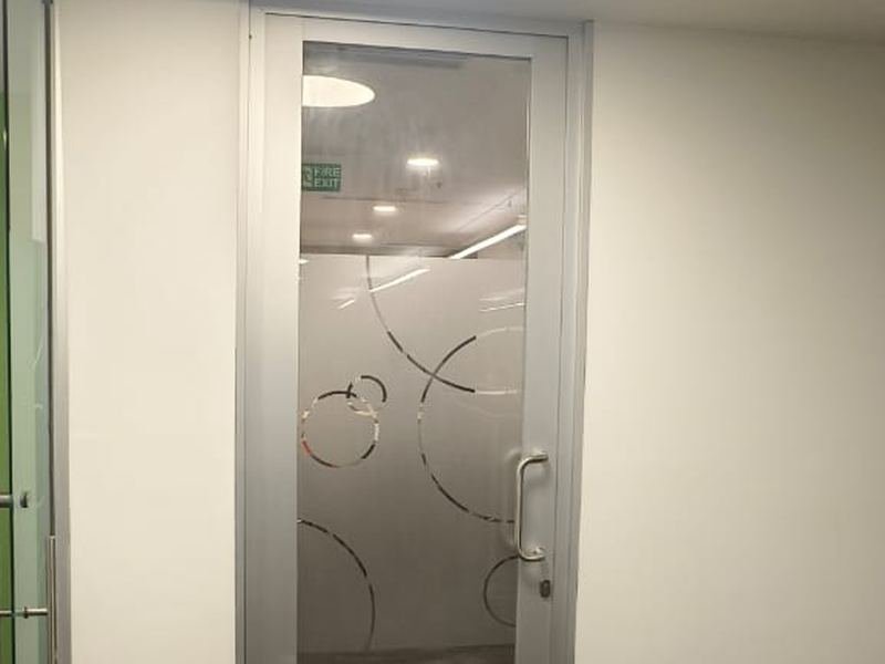 Glazed Door with Circular Cove Light — commercial office fit-out by MS Interior, Hyderabad